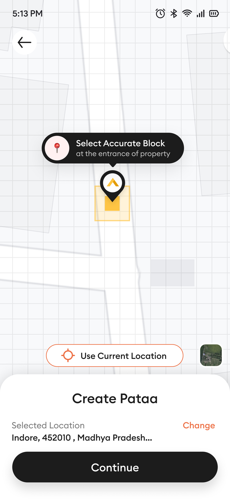 Select the accurate block: a map with the black-and-amber pin on one small block at a property entrance.